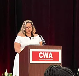 Liz Mercado speaking at CWA Human Rights Conference